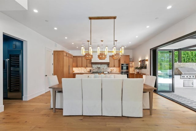 417 Warwick Ave, Cardiff By The Sea, CA 92007 - kitchen featuring tasteful backsplash, a center island with sink, recessed lighting, stainless steel double oven, and light countertops