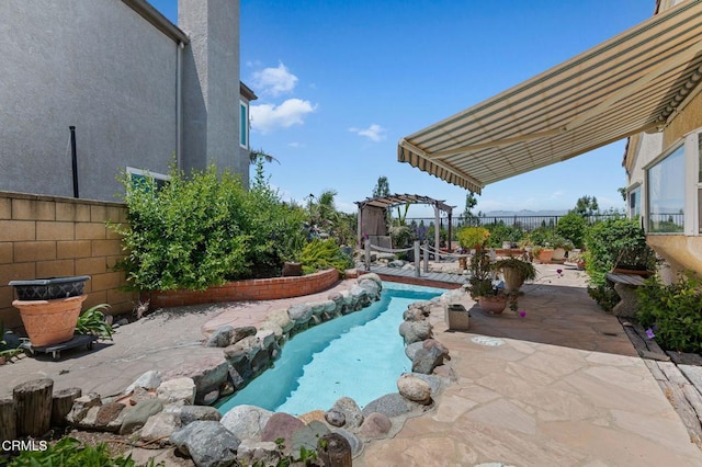 view of swimming pool featuring a patio and a fenced backyard