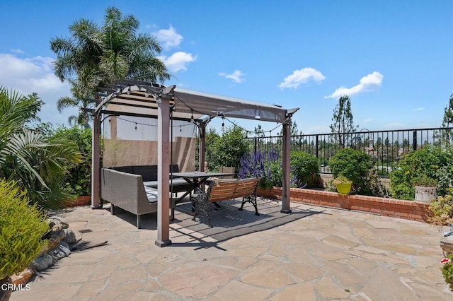 view of patio / terrace featuring outdoor dining space, a pergola, and a fenced backyard
