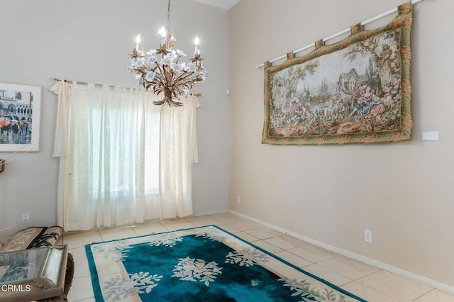 unfurnished dining area featuring a chandelier, tile patterned floors, and baseboards