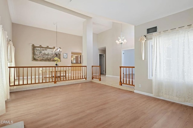 4078 Bending Oak Ct, Moorpark, CA 93021 - spare room featuring a chandelier, wood finished floors, and a towering ceiling