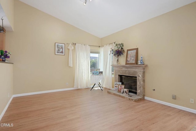 4078 Bending Oak Ct, Moorpark, CA 93021 - unfurnished living room featuring vaulted ceiling, wood finished floors, and a high end fireplace