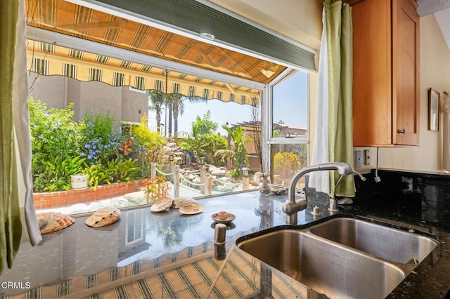 4078 Bending Oak Ct, Moorpark, CA 93021 - kitchen featuring brown cabinetry and dark stone countertops