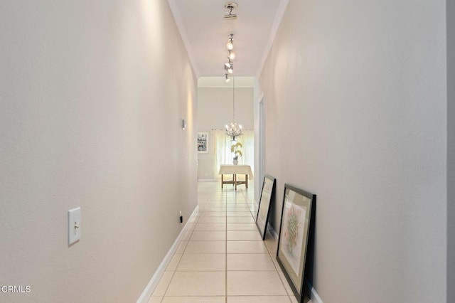 4078 Bending Oak Ct, Moorpark, CA 93021 - hallway with light tile patterned flooring, a chandelier, and ornamental molding