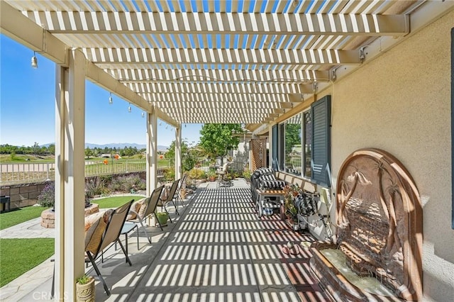 19575 Vermillion Ln, Apple Valley, CA 92308 - view of patio featuring a fenced backyard, a pergola, and a mountain view