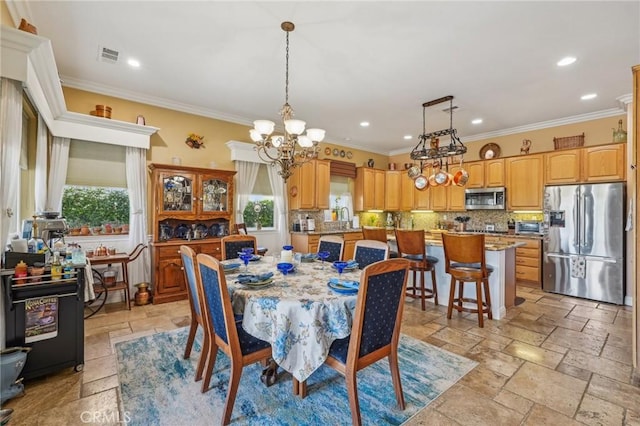 19575 Vermillion Ln, Apple Valley, CA 92308 - dining room with healthy amount of natural light, stone tile floors, a chandelier, ornamental molding, and recessed lighting