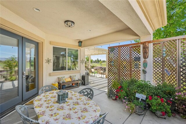 19575 Vermillion Ln, Apple Valley, CA 92308 - view of patio featuring outdoor dining area and french doors