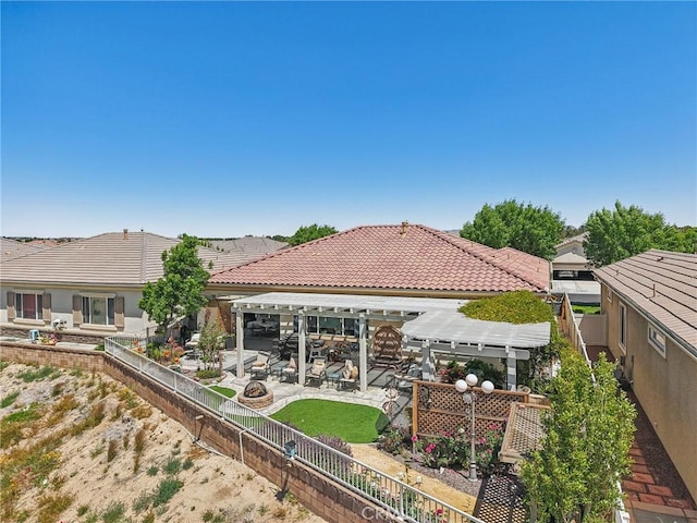 19575 Vermillion Ln, Apple Valley, CA 92308 - back of house with a fenced backyard, a patio area, and a tile roof
