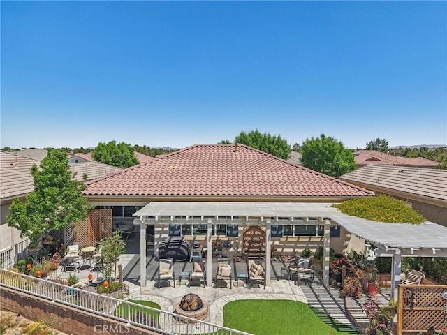 19575 Vermillion Ln, Apple Valley, CA 92308 - rear view of house featuring a patio, a fire pit, a pergola, a fenced backyard, and a tiled roof