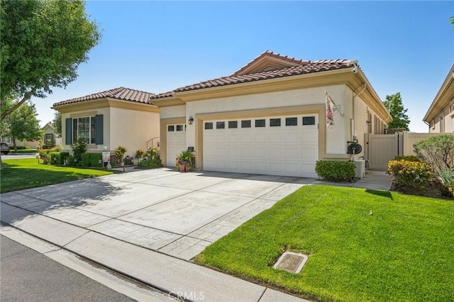 19575 Vermillion Ln, Apple Valley, CA 92308 - mediterranean / spanish-style home with a garage, driveway, stucco siding, and a tiled roof