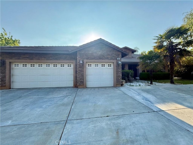 9869 Kehl Canyon Rd, Cherry Valley, CA 92223 - single story home with driveway, an attached garage, and stone siding
