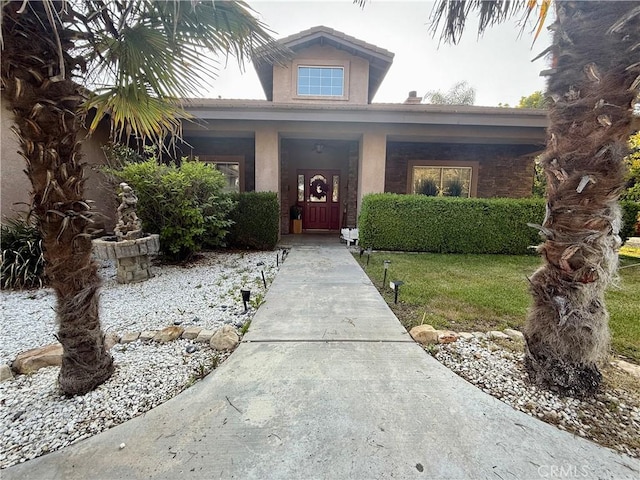 9869 Kehl Canyon Rd, Cherry Valley, CA 92223 - entrance to property featuring stucco siding and a porch