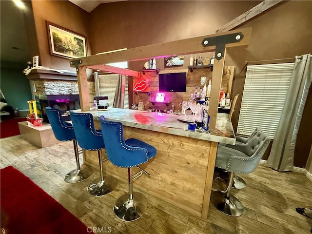 9869 Kehl Canyon Rd, Cherry Valley, CA 92223 - bar featuring wood finished floors and a stone fireplace