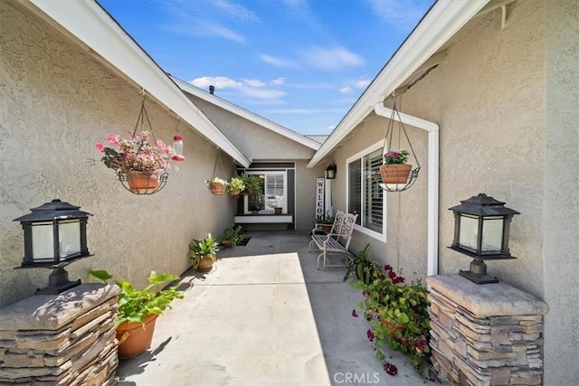 1266 Marina Rd, Corona, CA 92880 - property entrance with stucco siding and a patio area