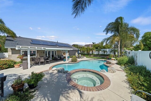 1266 Marina Rd, Corona, CA 92880 - view of pool featuring outdoor dining space, a patio area, a fenced backyard, a pool with connected hot tub, and an outdoor hangout area