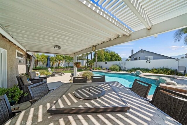 1266 Marina Rd, Corona, CA 92880 - view of patio / terrace with outdoor dining area, a fenced backyard, and a pool with connected hot tub