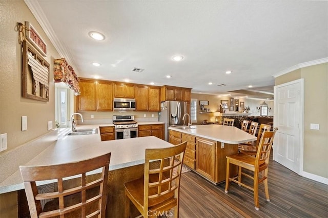 1266 Marina Rd, Corona, CA 92880 - kitchen with appliances with stainless steel finishes, a sink, crown molding, light countertops, and recessed lighting