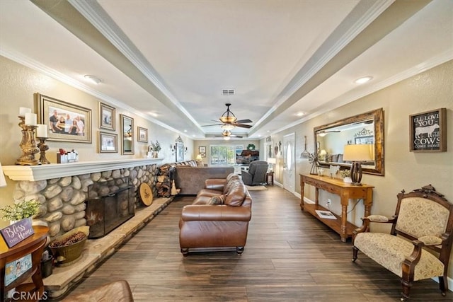 1266 Marina Rd, Corona, CA 92880 - living area with a fireplace, a raised ceiling, crown molding, wood finished floors, and a ceiling fan