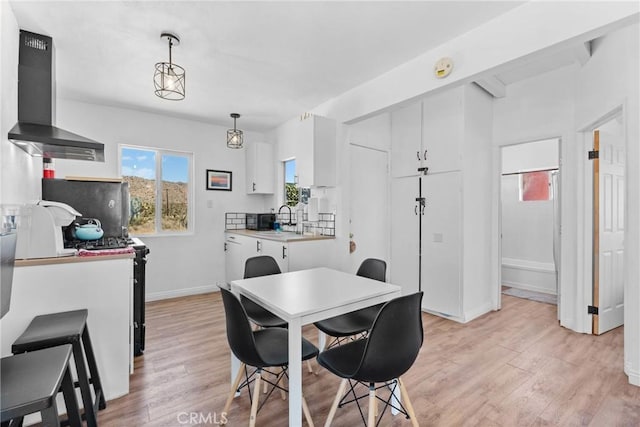 59101 Joshua Dr, Yucca Valley, CA 92284 - dining room featuring light wood-style flooring and baseboards