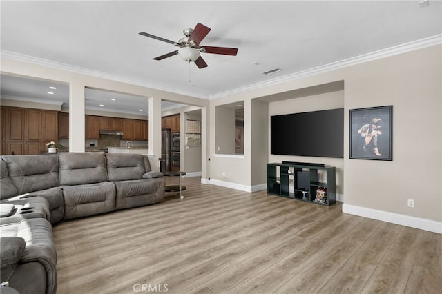 14215 Rolling Stream Pl, Eastvale, CA 92880 - living room with baseboards, light wood-style flooring, ceiling fan, crown molding, and recessed lighting