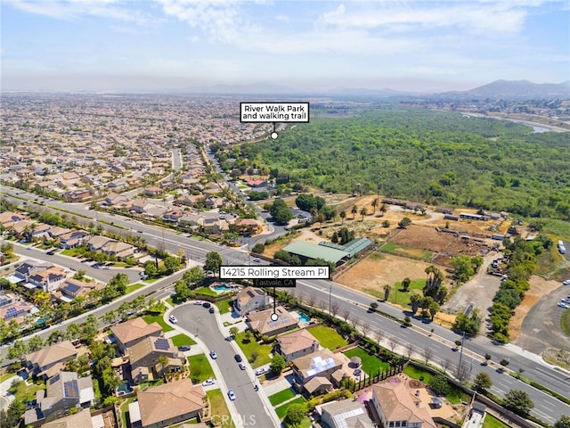 14215 Rolling Stream Pl, Eastvale, CA 92880 - aerial view of property's location featuring a mountain backdrop and nearby suburban area