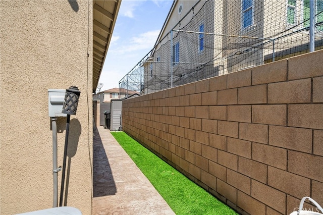 14215 Rolling Stream Pl, Eastvale, CA 92880 - view of side of property with fence and stucco siding