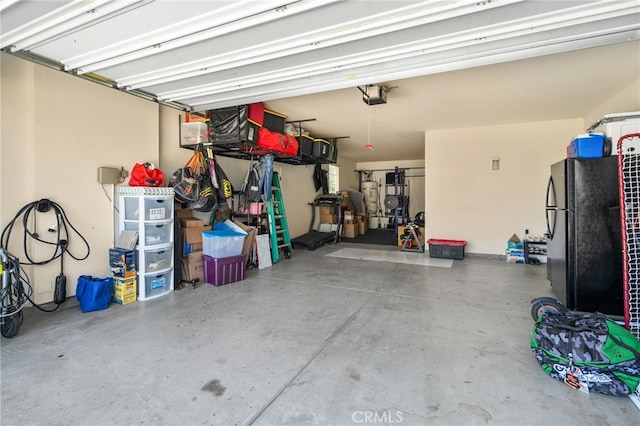 14215 Rolling Stream Pl, Eastvale, CA 92880 - garage with freestanding refrigerator and a garage door opener