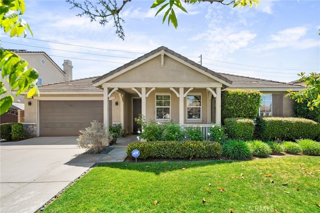 14215 Rolling Stream Pl, Eastvale, CA 92880 - view of front of home with stucco siding, an attached garage, driveway, a front yard, and a porch