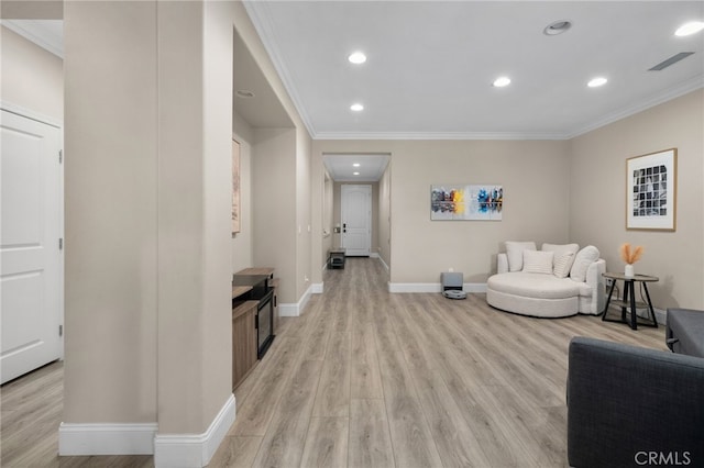 14215 Rolling Stream Pl, Eastvale, CA 92880 - sitting room featuring light wood-style floors, ornamental molding, baseboards, and recessed lighting