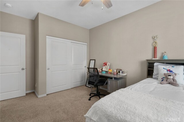 14215 Rolling Stream Pl, Eastvale, CA 92880 - carpeted bedroom with a closet, a ceiling fan, and baseboards