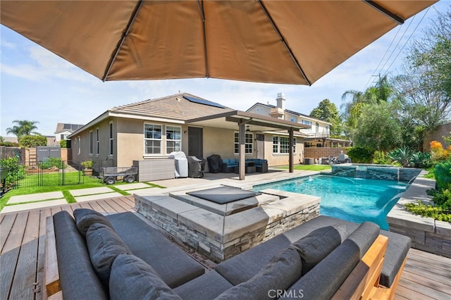 14215 Rolling Stream Pl, Eastvale, CA 92880 - view of pool with outdoor lounge area, a fenced backyard, and a deck