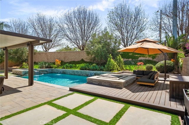 14215 Rolling Stream Pl, Eastvale, CA 92880 - view of swimming pool with a deck, a fenced backyard, a pool with connected hot tub, and outdoor lounge area