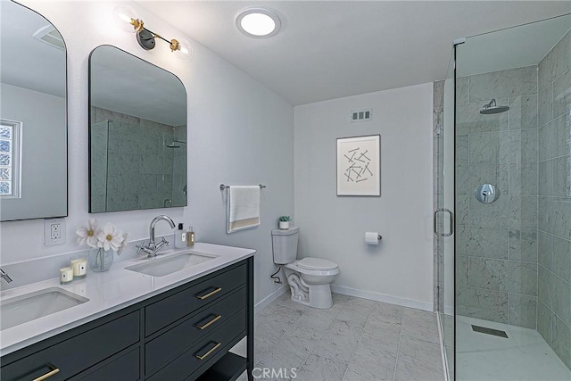 654 Carina Dr, Lompoc, CA 93436 - bathroom featuring a tile shower, toilet, baseboards, and double vanity