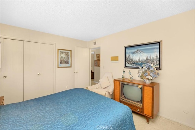 18132 James Rd, Villa Park, CA 92861 - bedroom with light carpet, a closet, and a textured ceiling