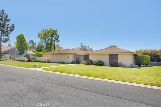 18132 James Rd, Villa Park, CA 92861 - ranch-style home featuring a front lawn and stucco siding