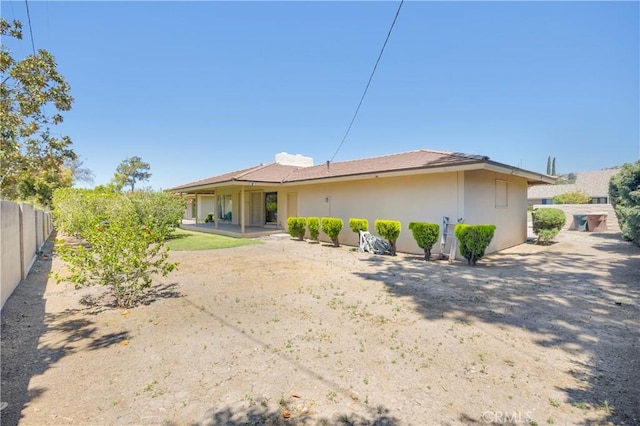 18132 James Rd, Villa Park, CA 92861 - rear view of property featuring stucco siding and fence