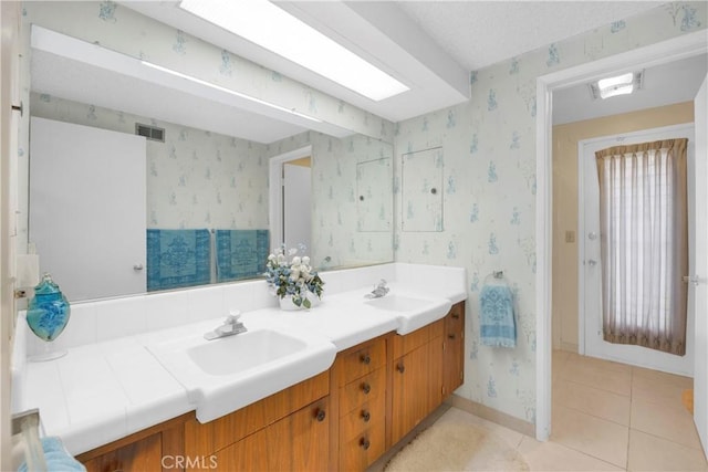 18132 James Rd, Villa Park, CA 92861 - full bathroom featuring wallpapered walls, baseboards, double vanity, and tile patterned floors