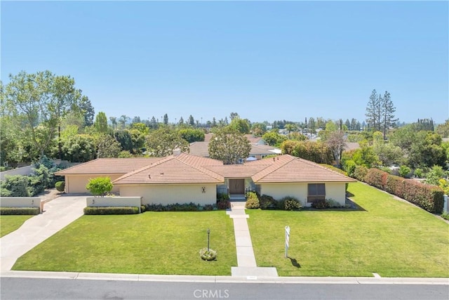 18132 James Rd, Villa Park, CA 92861 - ranch-style house featuring driveway, a front yard, a garage, and a tile roof