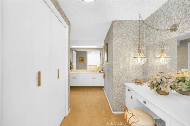 18132 James Rd, Villa Park, CA 92861 - corridor featuring light colored carpet and a textured ceiling