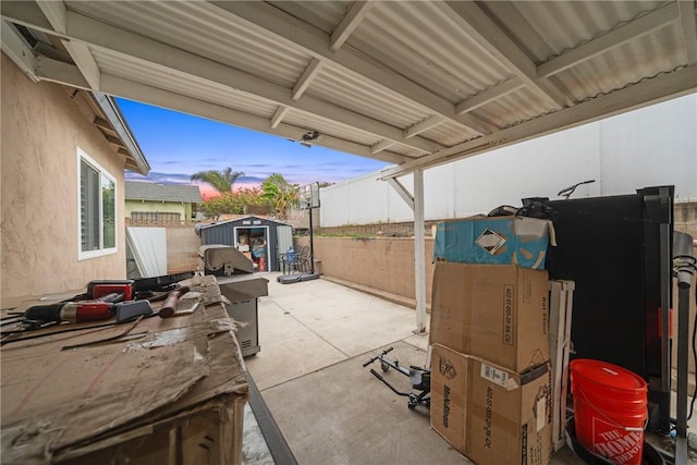 3727 Byrd St, San Diego, CA 92154 - view of patio / terrace with fence, a storage shed, and an outbuilding
