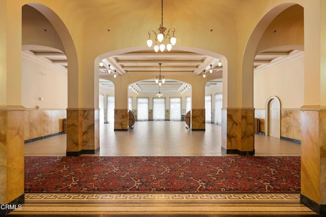 99 S Raymond Ave Unit 409, Pasadena, CA 91105 - lobby featuring a wainscoted wall and beam ceiling