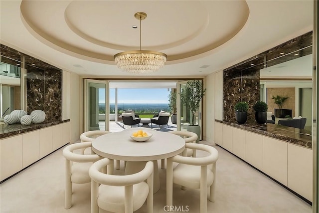 dining space featuring a chandelier