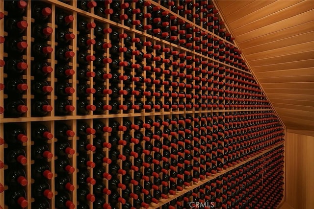 wine area with wood ceiling and vaulted ceiling