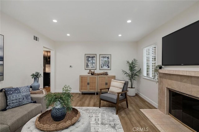 18017 Glenburn Ave, Torrance, CA 90504 - living room with wood finished floors, recessed lighting, baseboards, and a fireplace