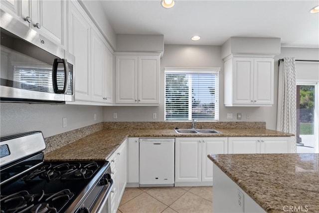 42631 Hussar Ct, Temecula, CA 92592 - kitchen featuring appliances with stainless steel finishes, a sink, light tile patterned floors, white cabinetry, and recessed lighting