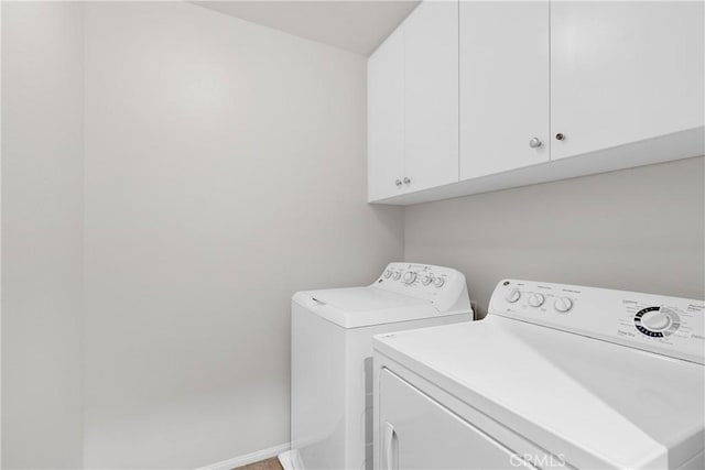 42631 Hussar Ct, Temecula, CA 92592 - washroom featuring cabinet space, washing machine and dryer, and baseboards