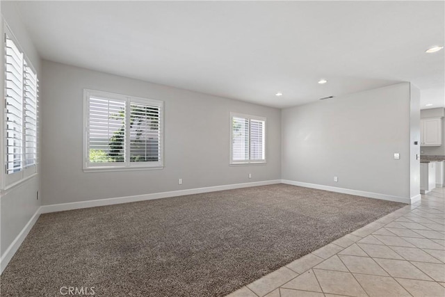 42631 Hussar Ct, Temecula, CA 92592 - empty room featuring healthy amount of natural light, light tile patterned floors, recessed lighting, and baseboards