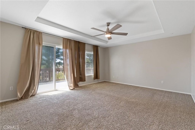 42631 Hussar Ct, Temecula, CA 92592 - carpeted empty room with a tray ceiling, ceiling fan, and baseboards