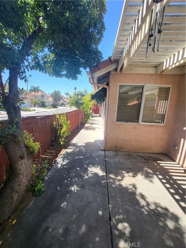 40132 Zamura Ct, Murrieta, CA 92562 - view of home's exterior featuring stucco siding, a patio area, and a fenced backyard