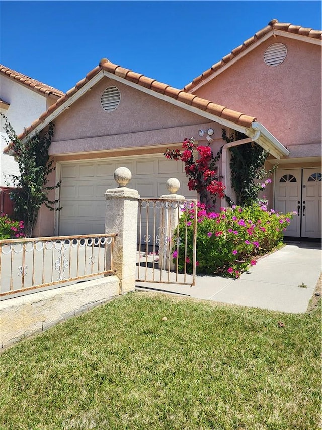 40132 Zamura Ct, Murrieta, CA 92562 - view of front facade with fence, a garage, stucco siding, and a tiled roof